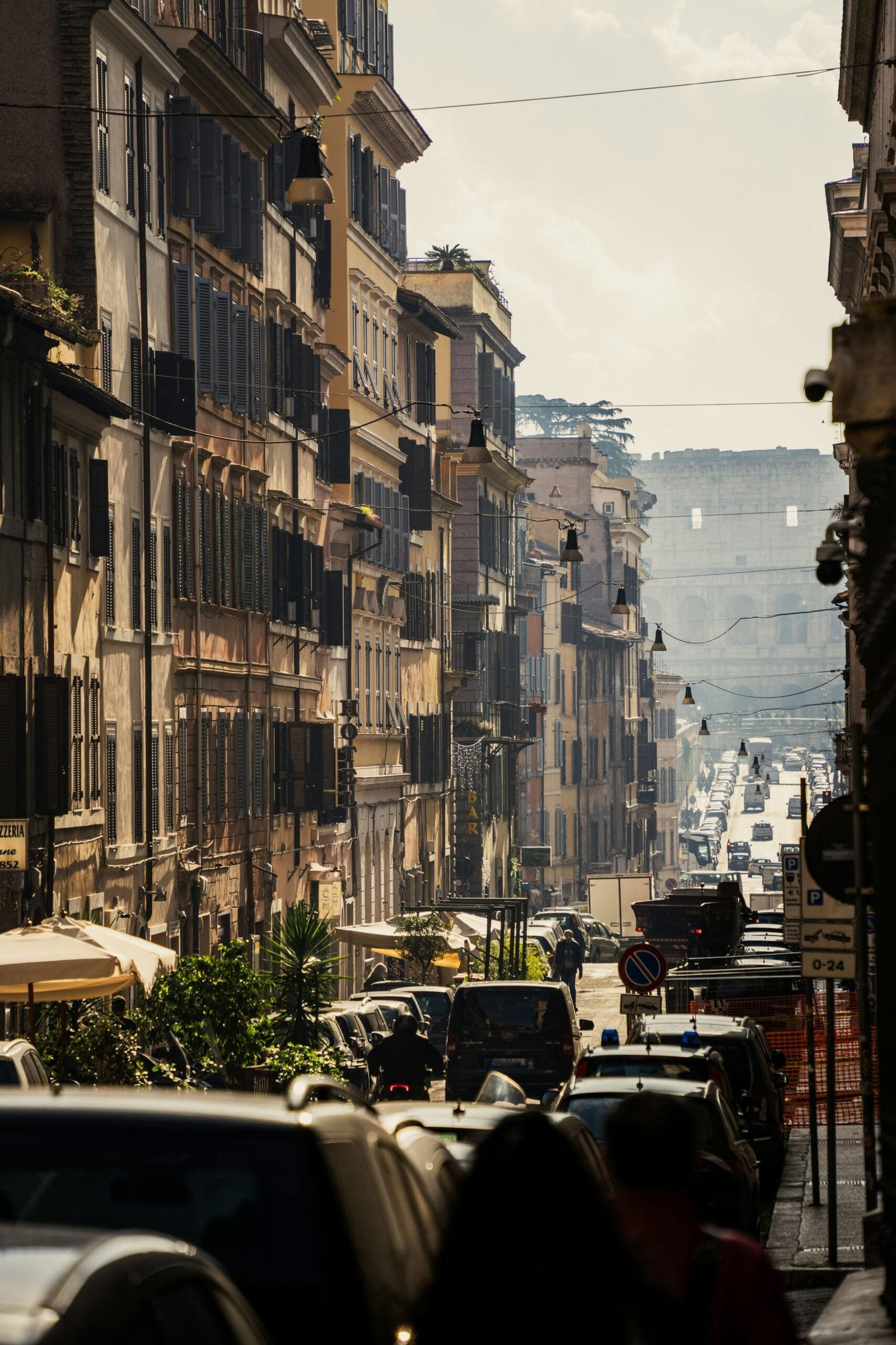 A city street filled with lots of tall buildings